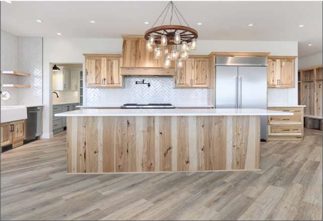 Powder Ridge kitchen with hickory cabinets, large island and wagon-wheel chandelier